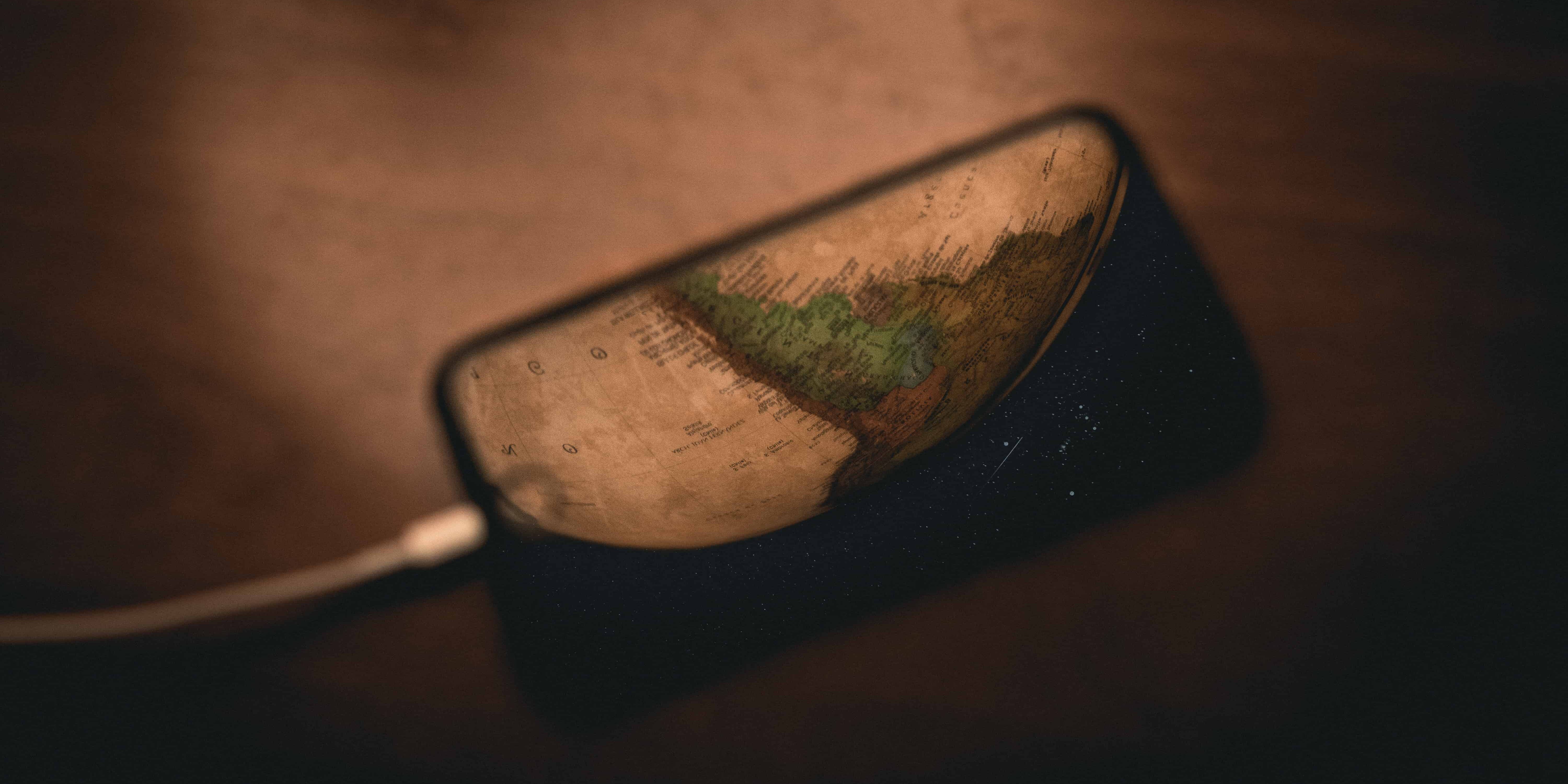black framed eyeglasses on brown wooden table