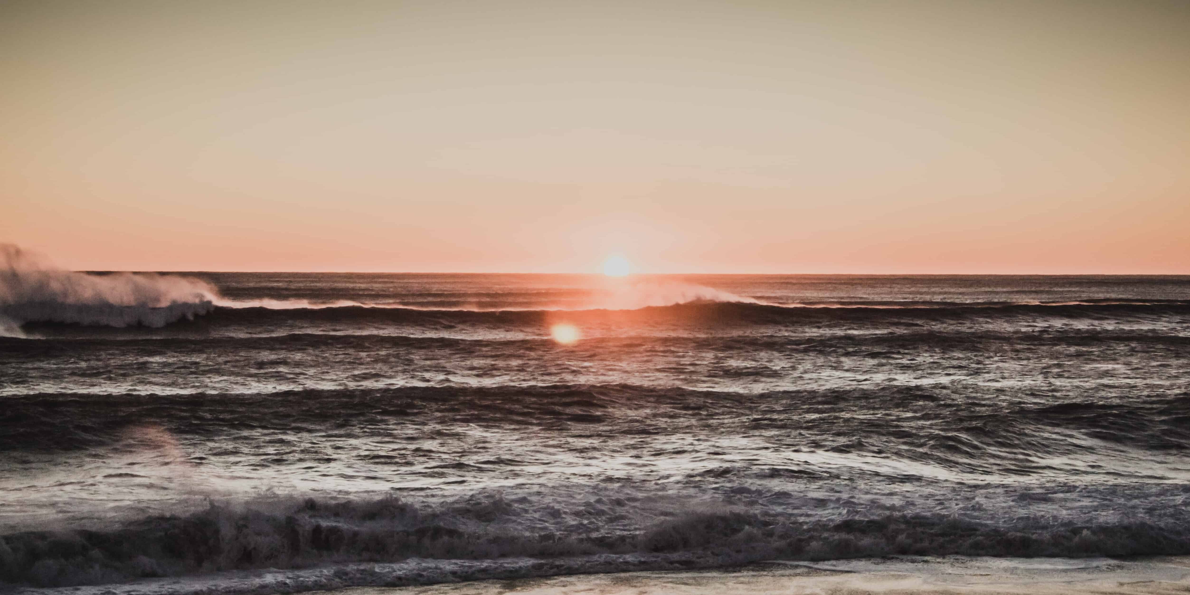 sea wave during golden hour