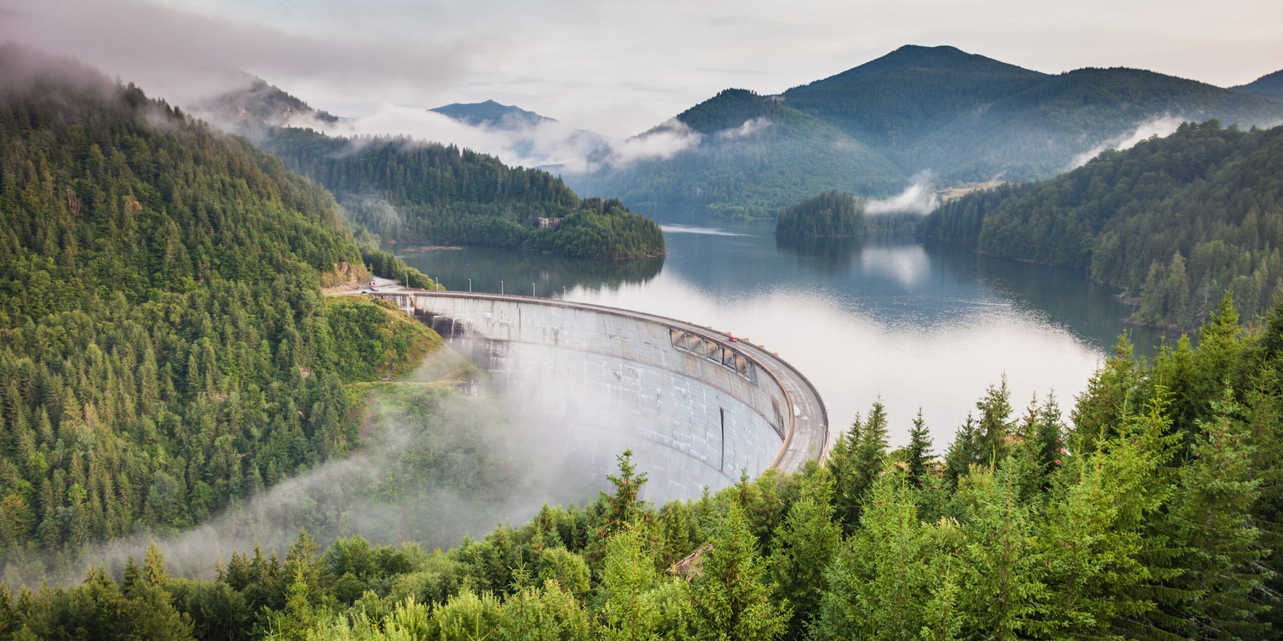 white bridge between mountains